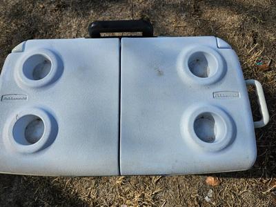 Rubbermaid cooler and a new Coleman griddle and a small umbrella