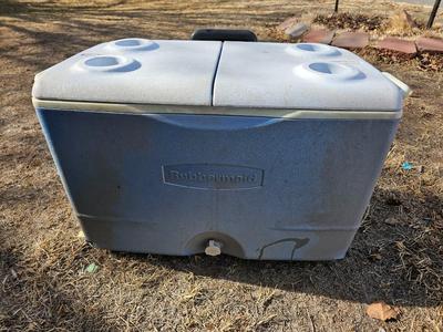 Rubbermaid cooler and a new Coleman griddle and a small umbrella