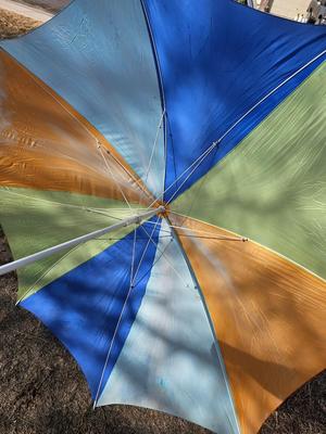 Beach toys with bucket - water noodles - and an umbrella
