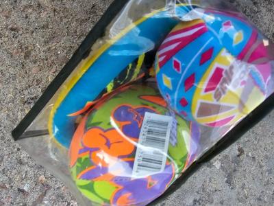 Beach toys with bucket - water noodles - and an umbrella