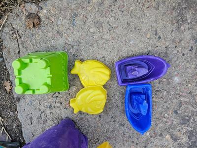 Beach toys with bucket - water noodles - and an umbrella