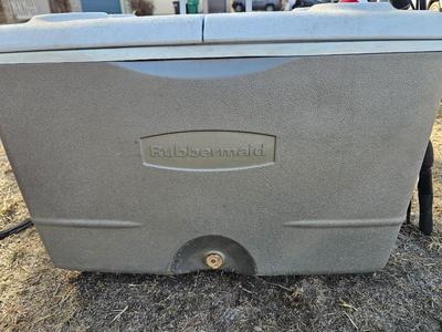Rubbermaid cooler with folding chair and two fishing rods