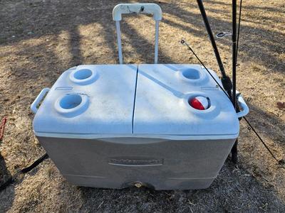 Rubbermaid cooler with folding chair and two fishing rods