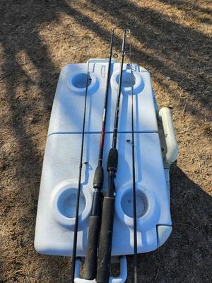 Rubbermaid cooler with folding chair and two fishing rods