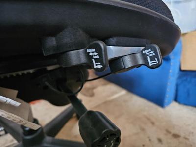 Adjustable ergonomic office chair with old school steel trash can