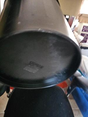 Adjustable ergonomic office chair with old school steel trash can