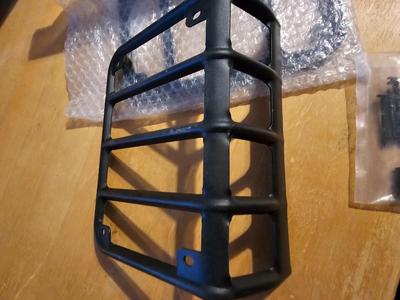 Two metal taillight covers for Jeep - Brand new ordered and they were the wrong size.