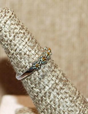 Size 6 Delicate Half Infinity Row of 9 Metal Flowers on a Silver Tone Band (1.9g)