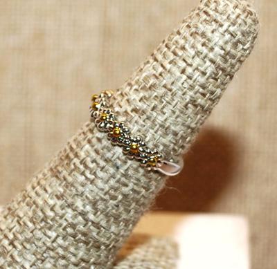 Size 6 Delicate Half Infinity Row of 9 Metal Flowers on a Silver Tone Band (1.9g)