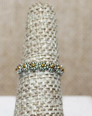 Size 6 Delicate Half Infinity Row of 9 Metal Flowers on a Silver Tone Band (1.9g)