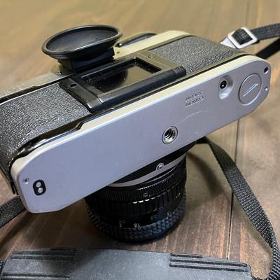 LOT 54W: Vintage 35mm Film Camera - Cannon AE-1 with Two Lenses and Manuals