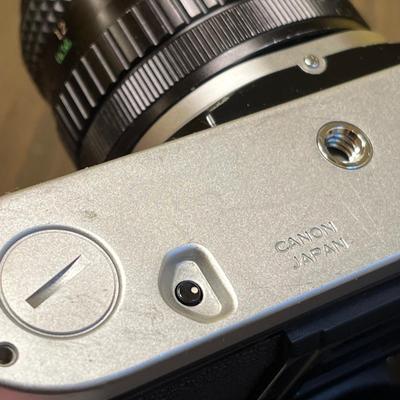 LOT 54W: Vintage 35mm Film Camera - Cannon AE-1 with Two Lenses and Manuals
