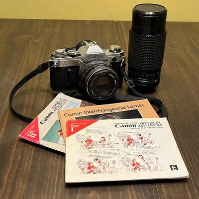 LOT 54W: Vintage 35mm Film Camera - Cannon AE-1 with Two Lenses and Manuals
