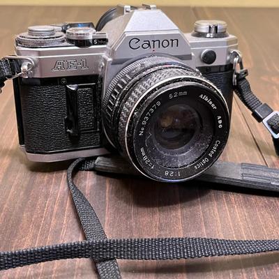 LOT 54W: Vintage 35mm Film Camera - Cannon AE-1 with Two Lenses and Manuals