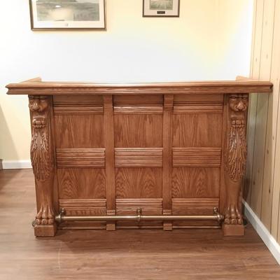 LOT 86B: Vintage Lion Head Oak Bar with Brass Top and Footrest & Set of (2) Swivel Oak Bar Stools