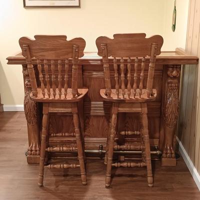 LOT 86B: Vintage Lion Head Oak Bar with Brass Top and Footrest & Set of (2) Swivel Oak Bar Stools