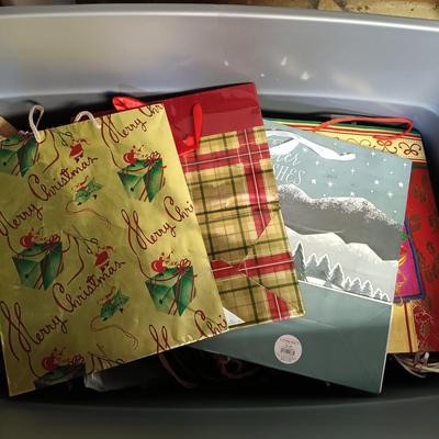 LOT 101B: Basement Finds- Large Collection of Assorted Holiday Bags w/ Christmas Decor