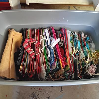 LOT 101B: Basement Finds- Large Collection of Assorted Holiday Bags w/ Christmas Decor