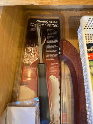 AN ARRAY OF KITCHEN KNIFES, ACHIP CORRECTOR, AND MORE