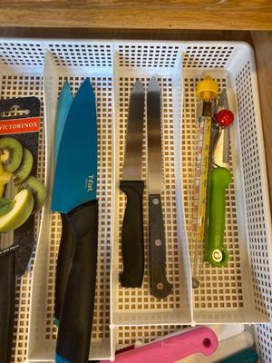 AN ARRAY OF KITCHEN KNIFES, ACHIP CORRECTOR, AND MORE