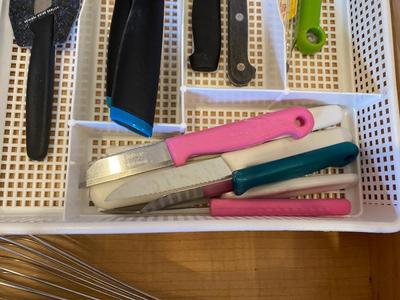 AN ARRAY OF KITCHEN KNIFES, ACHIP CORRECTOR, AND MORE