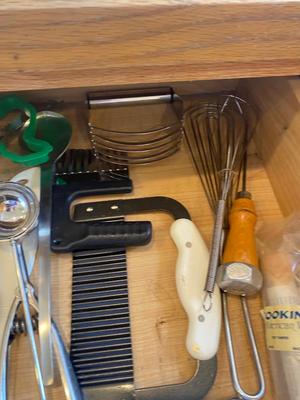A BUNCH OF KITCHEN DRAWER UTENSILS ITEMS