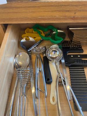 A BUNCH OF KITCHEN DRAWER UTENSILS ITEMS