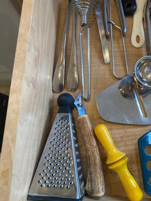 A BUNCH OF KITCHEN DRAWER UTENSILS ITEMS