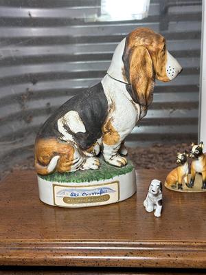 SKI COUNTRY BOURBON EMPTY DECANTER AND MINIATURE PORCELAIN DOGS