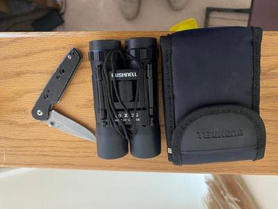 BUSHNELL BINOCULARS AND A GERBER POCKET KNIFE