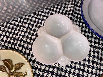 FENTON HOBNAIL SEPARATED DISH, ENAMEL WEAR PLATES, VINTAGE BREAD BOX, AND BRASS WALL HANGINGS