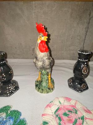 ROOSTER, CANDLESTICK HOLDERS, AND COLORFUL DOILIES,