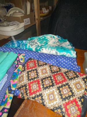SINGER, SEWING MACHINE IN A VARIETY. OF VINTAGE MATERIAL