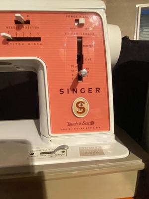 SINGER, SEWING MACHINE IN A VARIETY. OF VINTAGE MATERIAL