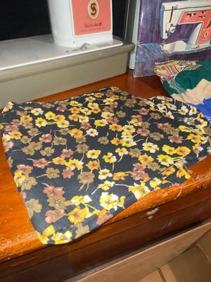 SINGER, SEWING MACHINE IN A VARIETY. OF VINTAGE MATERIAL