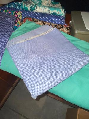SINGER, SEWING MACHINE IN A VARIETY. OF VINTAGE MATERIAL