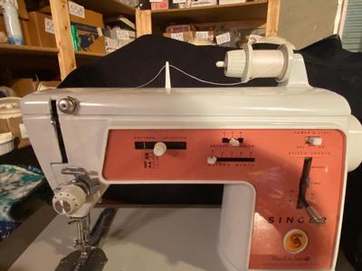 SINGER, SEWING MACHINE IN A VARIETY. OF VINTAGE MATERIAL