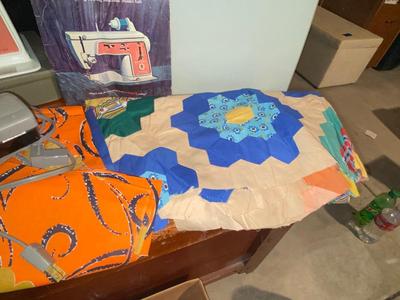 SINGER, SEWING MACHINE IN A VARIETY. OF VINTAGE MATERIAL