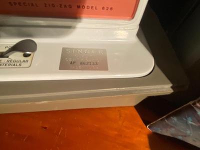 SINGER, SEWING MACHINE IN A VARIETY. OF VINTAGE MATERIAL
