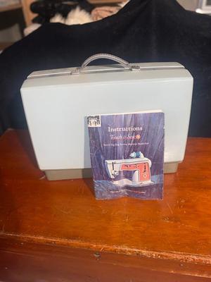 SINGER, SEWING MACHINE IN A VARIETY. OF VINTAGE MATERIAL