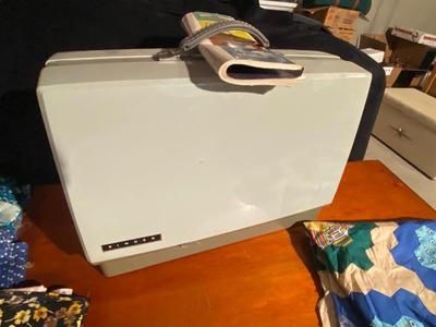 SINGER, SEWING MACHINE IN A VARIETY. OF VINTAGE MATERIAL