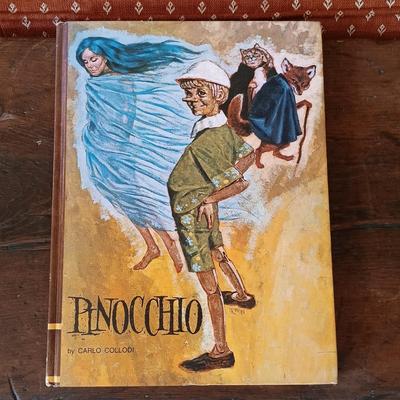 LOT 8: Large Resin Pinocchio Figurine w/ Resin Mickey Mouse Staue and Set of 3 Fairytale Books