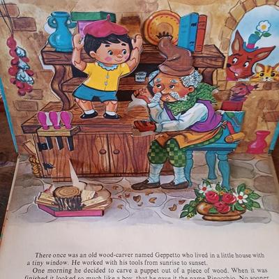 LOT 8: Large Resin Pinocchio Figurine w/ Resin Mickey Mouse Staue and Set of 3 Fairytale Books