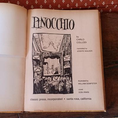 LOT 8: Large Resin Pinocchio Figurine w/ Resin Mickey Mouse Staue and Set of 3 Fairytale Books