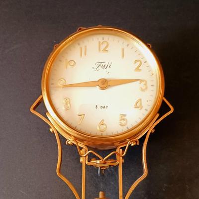 LOT 10: Fuji Elephant 8-Day Mystery Swinging Clock