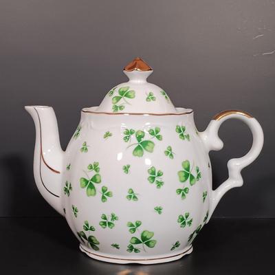 LOT 19: Lefton Shamrock Music Box Teapot and Teacup with O'Dunk 'n' O'Bright Placemats and Mugs & More