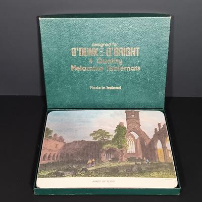 LOT 19: Lefton Shamrock Music Box Teapot and Teacup with O'Dunk 'n' O'Bright Placemats and Mugs & More