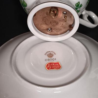 LOT 19: Lefton Shamrock Music Box Teapot and Teacup with O'Dunk 'n' O'Bright Placemats and Mugs & More