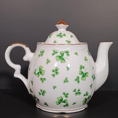 LOT 19: Lefton Shamrock Music Box Teapot and Teacup with O'Dunk 'n' O'Bright Placemats and Mugs & More