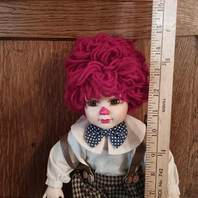 LOT 180: Cardinal Musical Clown Doll, Celluloid and Cloth Clown Doll, Frankel Porcelain Clown & More